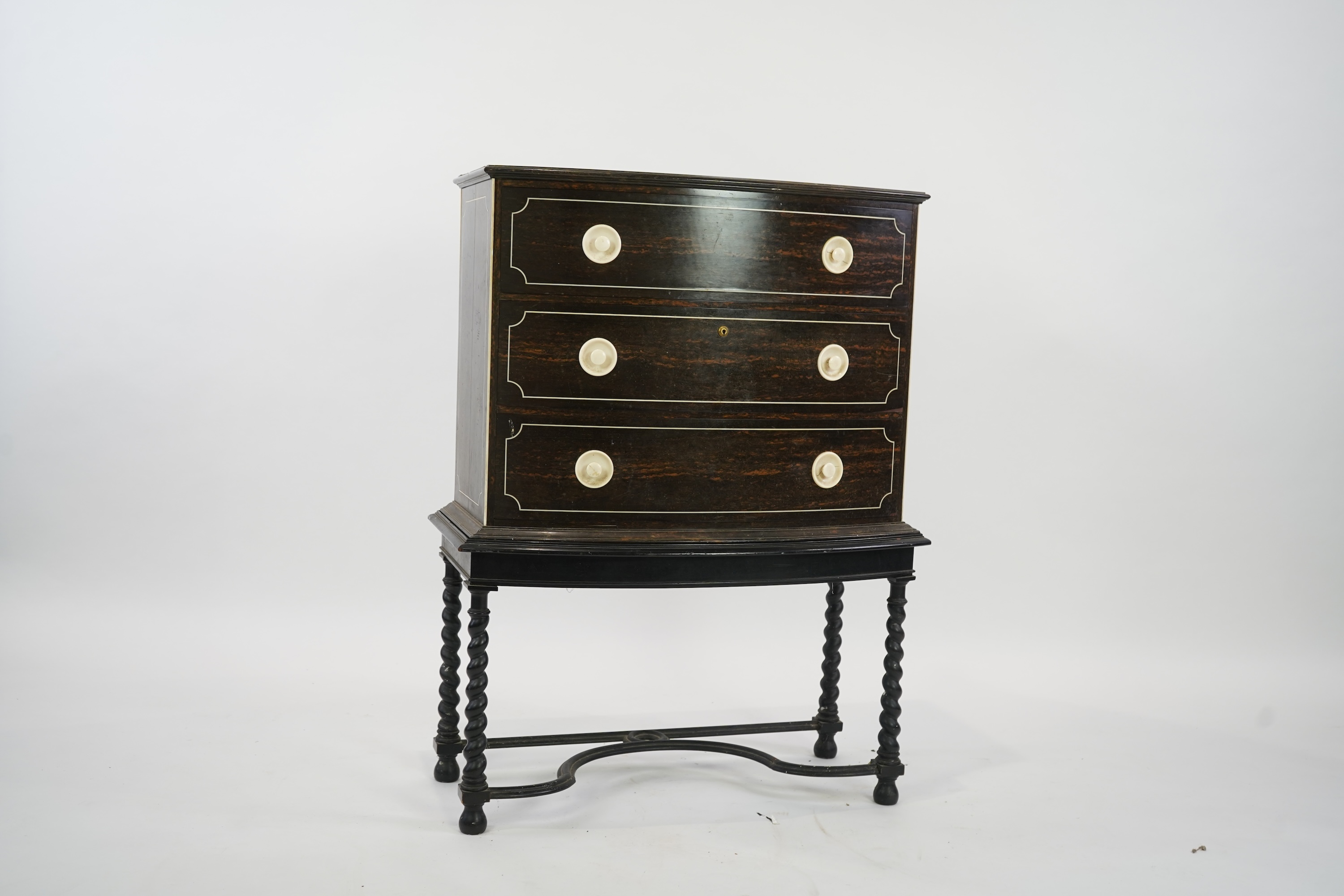 An early 20th century ivory mounted coromandel three drawer bowfront chest, stamped Callow of Mount Street, London